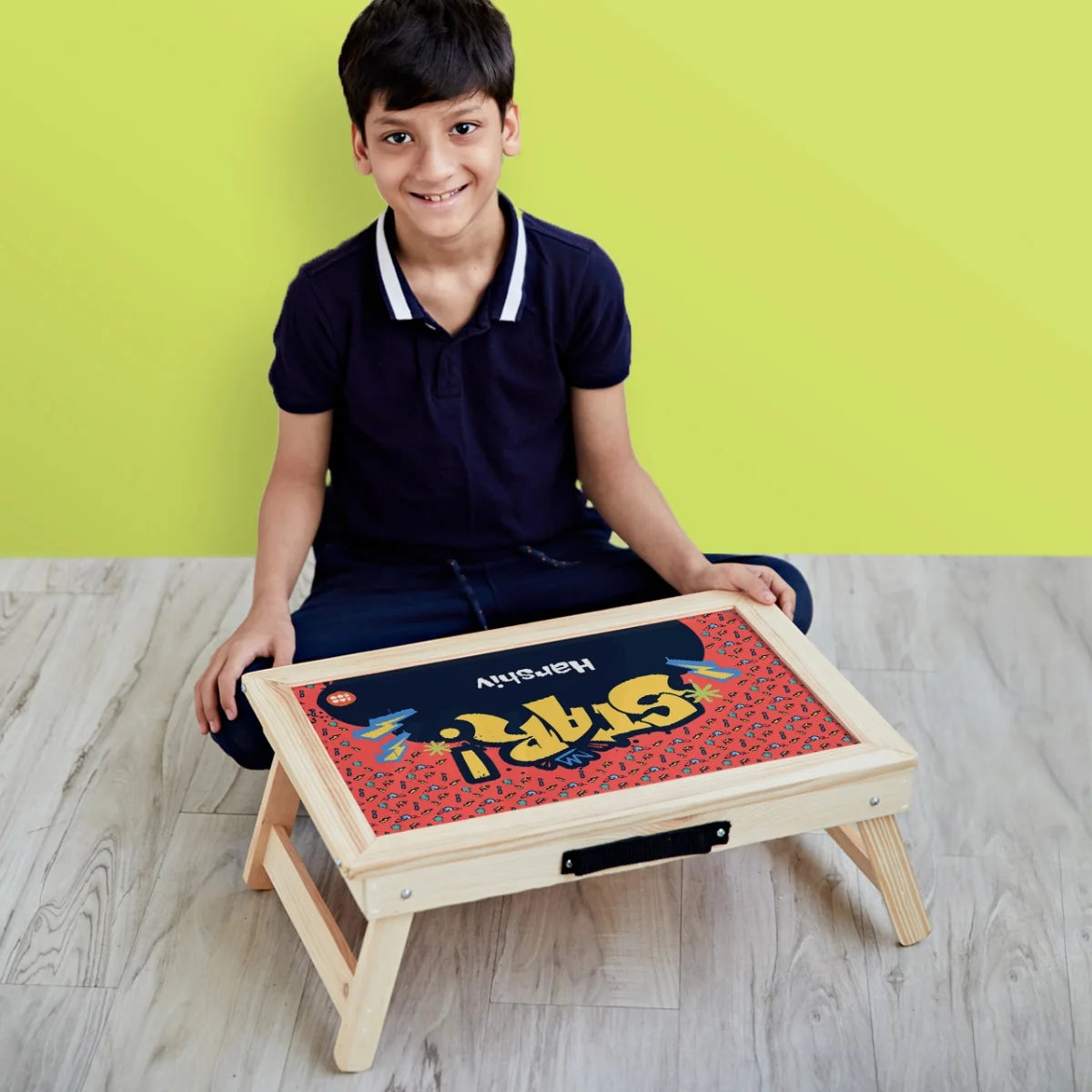 A child writes on a reusable, magnetic , with a personalized drawstring bag, a personalized water bottle
