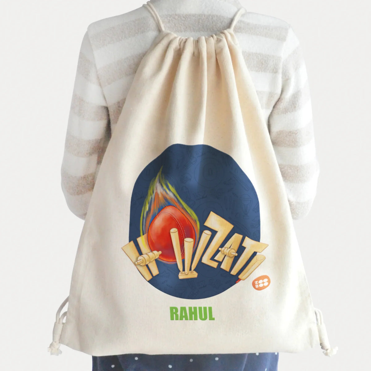A cream-colored, cotton, light weight, personalized drawstring backpack with a cricket design.