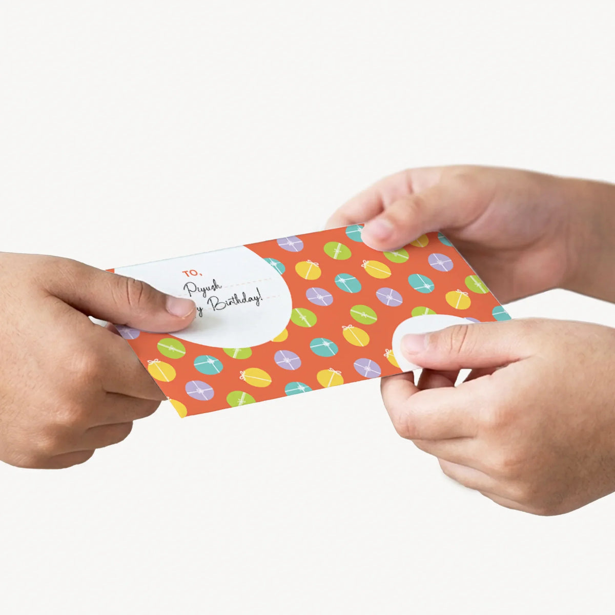 A person's hands gifting a personalized money envelope. 